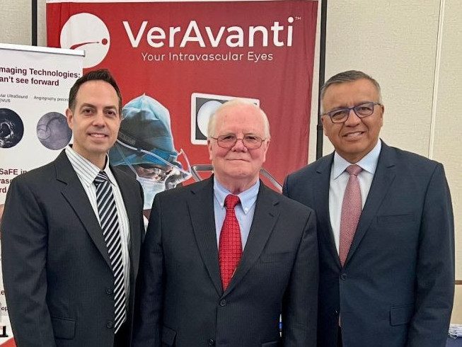 Juan Vegarra with VerAvanti leadership at a conference booth